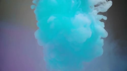 Turquoise and White Ink Flowing Together