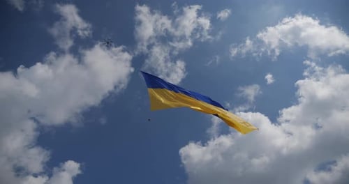 Flag Waving in Blue Cloudy Sky, Drone Footage