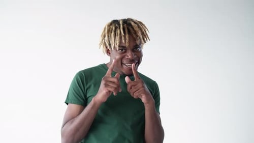 Smiling Young Adult Poses in Studio