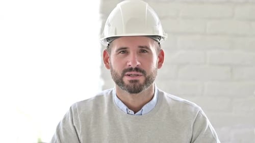 Portrait of Professional Young Engineer Doing Video Chat