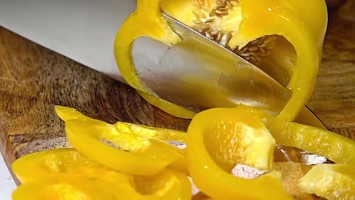 Slicing Yellow Bell Pepper on Cutting Board