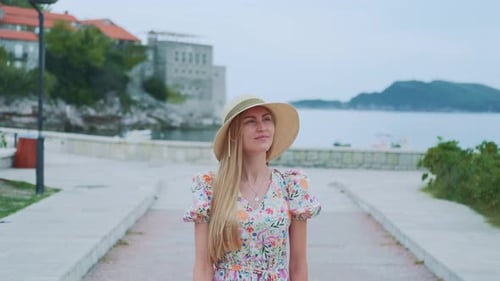 Pleasantlooking Woman Exploring a New Place Located By the Sea