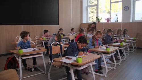 Diverse Children During Drawing Lesson at School