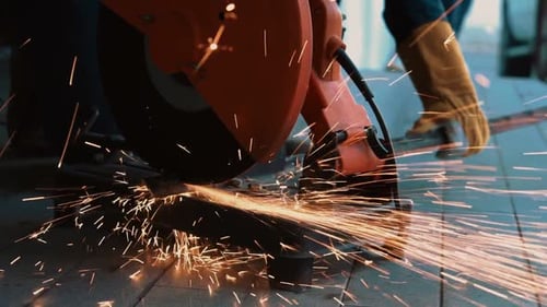 Professional Mechanic is Cutting Steel Metal