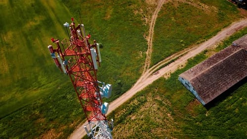 Aerial View of 4G and 5G Cell Tower with Antennas and Satellites