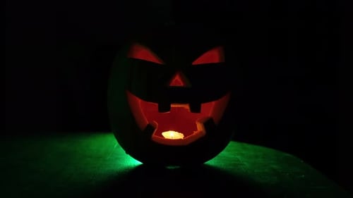 Sinister Halloween Pumpkin Lit By Candlelight