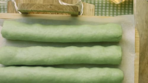 Green Dough Rolled Up with Cherry Filling