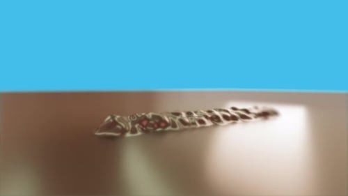 Piece Of Candy Coming From Liquid Chocolate 3D Animation