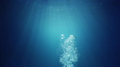 Air Bubbles Rising Up Through Blue Water