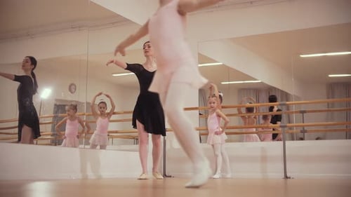 Ballet Instructor Teaches Children in Dance Studio