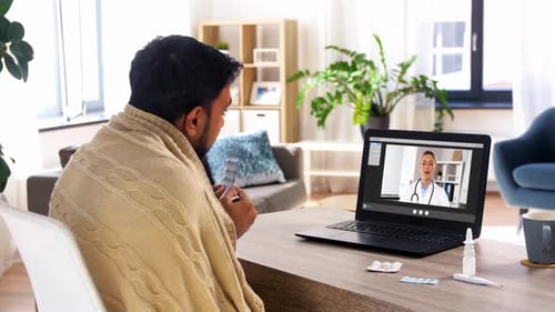 Telehealth Doctor Visit at Home with Laptop