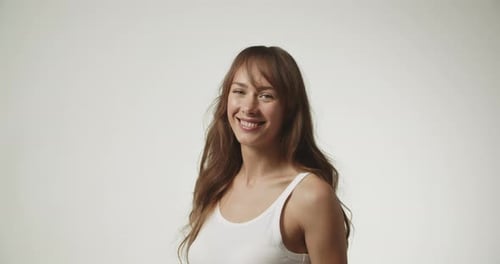 Happy Woman Smiling in Front of White Background