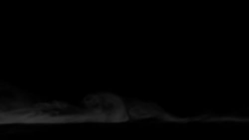 White Smoke Drifting Across Black Abstract Background