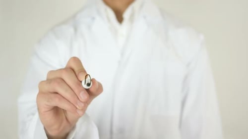 Doctor Writing Diabetes on Clear Surface