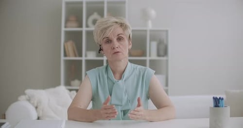 Woman Speaking on Video Conference From Home Office