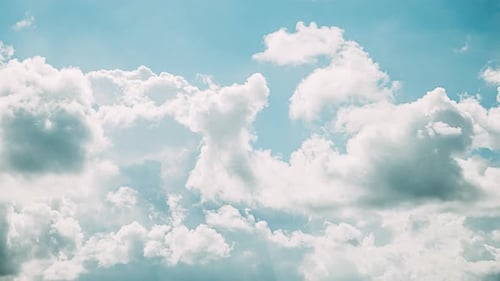 Cloudy Blue Sky With Fluffy Clouds