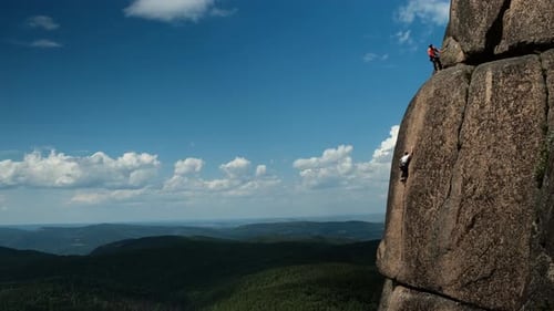 Mountaineering Competition. Two Rock Climbers Make an Ascent To the Top of the Mountain.