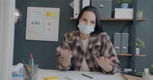 Portrait of Cheerful Employee Talking on Video Call From Office Wearing Face Mask During Pandemic