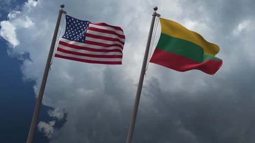 United States and Lithuania Flags Waving Together in Cloudy Sky