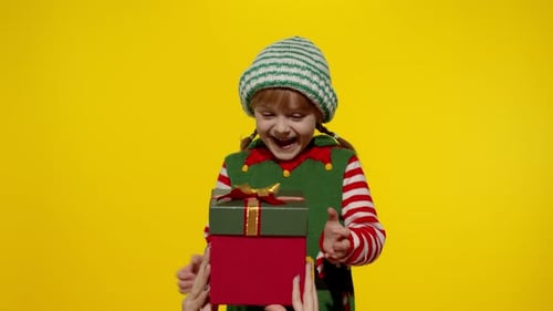 Excited Child Receiving a Christmas Present