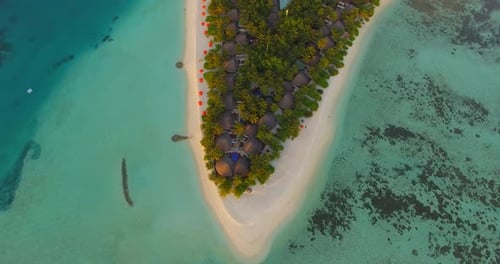 Aerial drone view of a scenic tropical island in the Maldives.