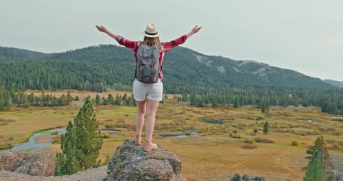 Young Woman in Red Classic Shirt Standing on Top of Mountain on Early Autumn Day