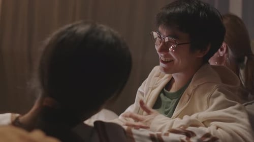 Friends Talking Indoors in Relaxed Setting