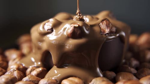 Milk Chocolate Being Poured on Chocolate Dessert