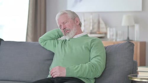 Exhausted Old Man Sleeping on Sofa