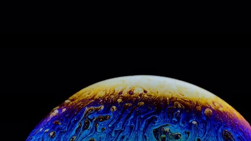 Iridescent Soap Bubble Surface Close-Up Abstract