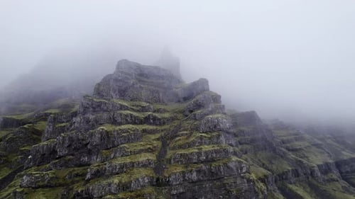 Drone Flight Towards Mountain Peak In Mist