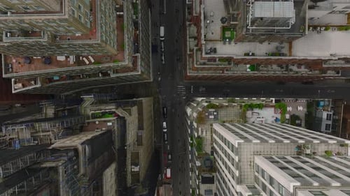 Top Down Panning Shot of High Rise Buildings Along Street in Urban Borough