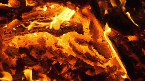 Hot Coals Burning Down a Large Fire and Glow Bright Red. Slow Motion 240 Fps