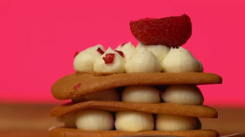 Decadent Dessert with Strawberries and Pink Background