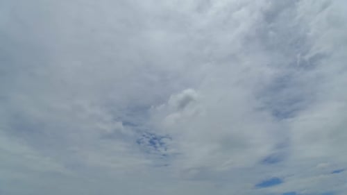 Time lapse of white cloud moving pass around sky background