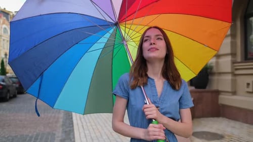 Woman with Colorfull Umbrella at the City Center