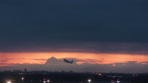 Takeoff on a Red Sky Background