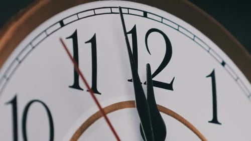 Old Retro Wall Clock with Moving Second Hand on White Circular Dial