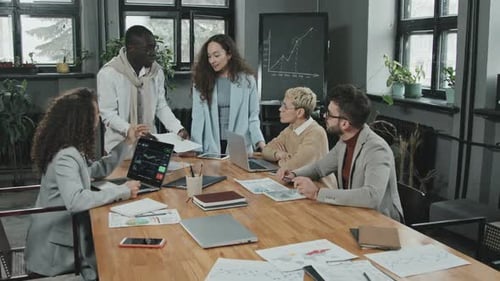 Team Discussing Business at Modern Office Workplace