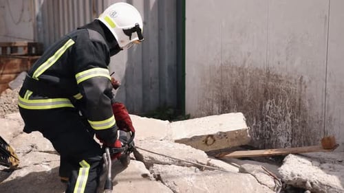 Firefighters Cutting Steel Rebar in Debris