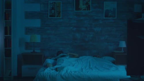 Woman Wakes Up Next to Sleeping Partner in Bed