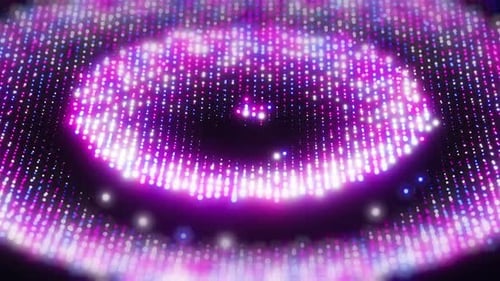 Multicolored dots oscillating from a musical beat