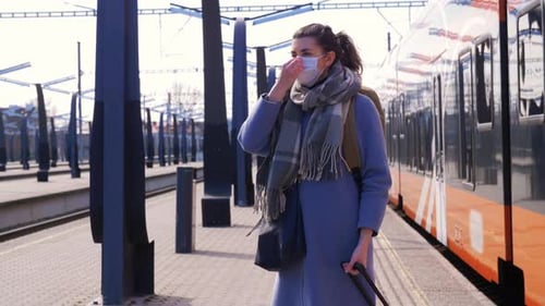 Woman in Protective Face Mask at Railway Station