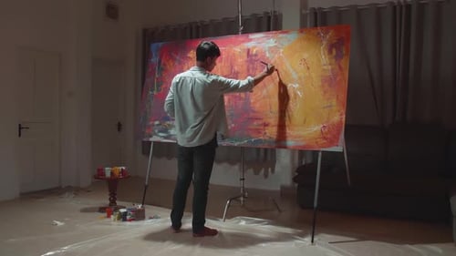 Young Artist Painting Abstract Art on Canvas Indoors
