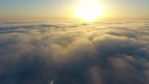 Golden Sunrise over Tranquil Clouds