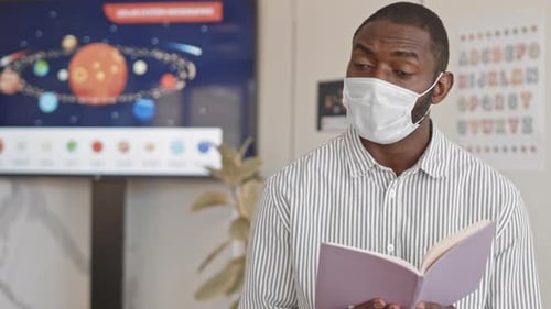 Afro-American School Teacher in Face Mask Having Science Lesson
