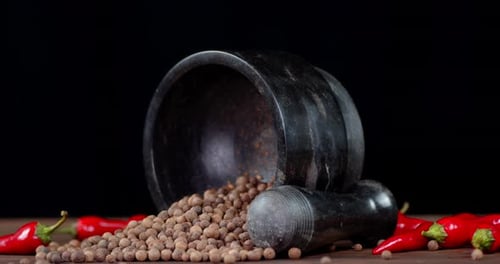 Marble Mortar and Pestle with Peppercorns and Chilies