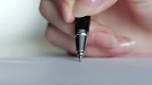 Close up of Woman Putting Signature