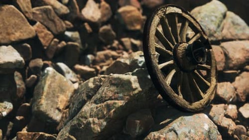 Old Wooden Wagon Wheel on Rocks Realistic Shot