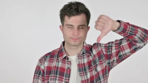 Portrait of Thumbs Down Gesture By Young Man
